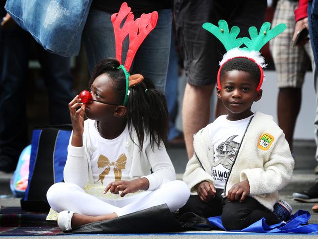 Jonievis Kamara, 5, with brother John Kamara, 3, at the Hobart Myer Christmas Pageant in 2016. John Kamara says his children are fortunate to have a good life in Tasmania, which is why the family started a charity to support children overseas who aren’t so fortunate. Picture: Nikki Davis-Jones