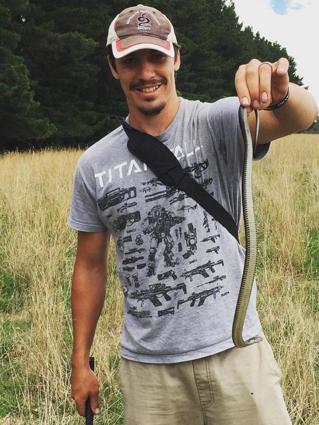 Kane with a snake out in the wild.