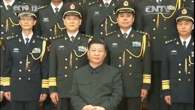 Chinese President Xi Jinping, seated, with Lieutenant-General Yang Xuejun, second from right, front row. Picture: CNTV