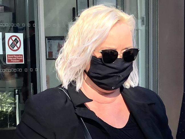 Shane Maree Hatton (black face mask) pictured at Nowra Local Court. Hatton is charged with 749 fraud offences after she allegedly ripped off the pro surfer siblings Tyler Wright, Owen Wright and Mikey Wright to the tune of $1.5 million while employed as their bookkeeper. Picture: Eliza Barr