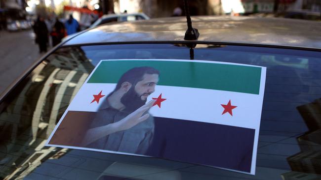 The portrait ofHayat Tahrir al-Sham (HTS) leader Abu Mohammed al-Jolani is pictured on the back of a car in the coastal Syrian city of Latakia. Picture: AFP.