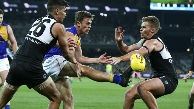 Luke Partington gets his kick away for West Coast. He is coming back to play for the Bays. Picture Sarah Reed