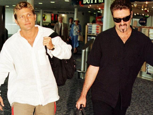 Singer George Michael (R) & Kenny Goss in 1998. Picture: AFP.