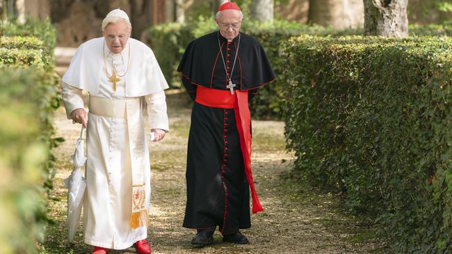 Anthony Hopkins as Pope Benedic and Jonathan Pryce as Cardinal Bergoglio in The Two Popes. Picture: Netflix via AP