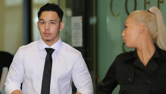 Phillip Isogon leaving court with his partner. Picture: Christian Gilles