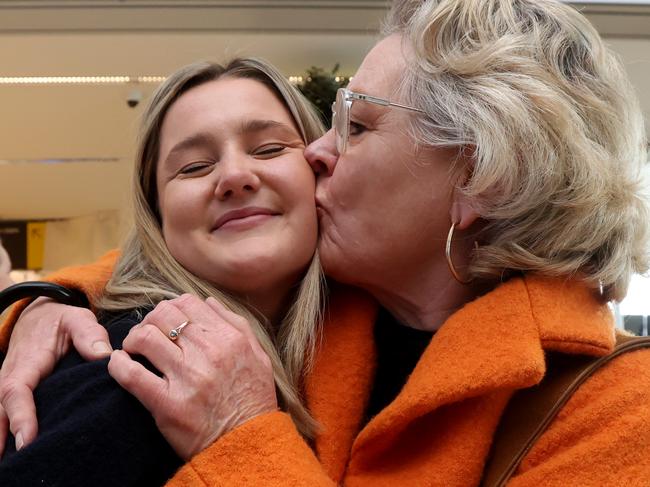 ADELAIDE, AUSTRALIA - NewsWire Photos September 24: Judy Wainwright reunites with her daughter Alice as the first plane from NSW lands at Adelaide Airport after boarder restrictions are lifted. Picture: NCA NewsWire / Kelly Barnes