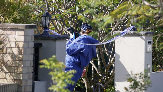 A forensics officer at a crime scene at a house on Layton St in Wentworthville, where George Vaz’s son Shayne allegedly stabbed him to death. Picture: Damian Shaw