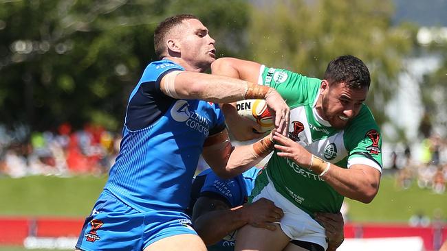 Api Pewhairangi of Ireland is tackled in the stifling Cairns heat.