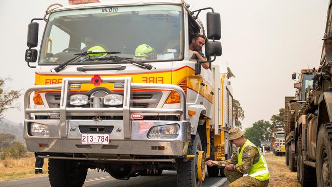 Corporal Jaymes Hasler, part of the crew of a Molongolo Brigade, Regional Fire Service truck, pumping up a flat tyre in Banks, ACT during the Orroral Valley Fire response. Picture: ADF