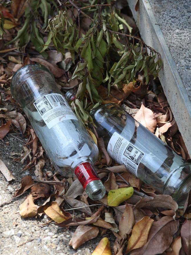 Empty vodka bottles in the street after a party in a house n Hope Island. Picture Glenn Hampson