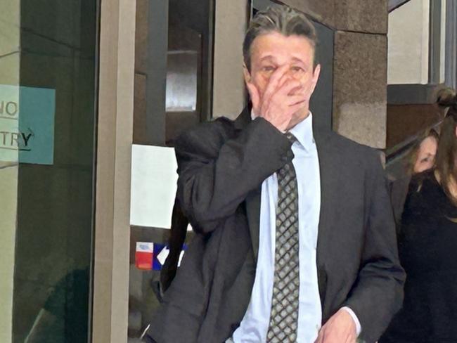 Chiropractor Ian Deitch, left, leaves Melbourne Magistrates' Court with his lawyer Simon Kenny, right, during a break in proceedings.