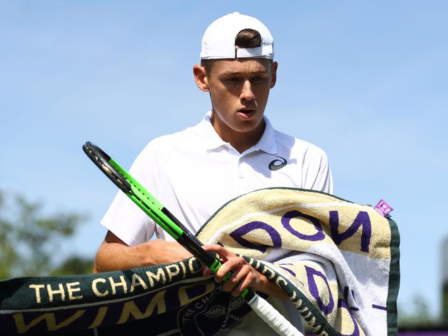 LONDON, ENGLAND - JULY 03:  Alex De Minaur of Australia with a towel during his Men's Singles first round match against Marco Cecchinato of Italy on day two of the Wimbledon Lawn Tennis Championships at All England Lawn Tennis and Croquet Club on July 3, 2018 in London, England.  (Photo by Matthew Lewis/Getty Images)