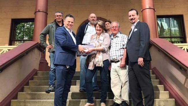 Heather and Bob Elliott hand over the 10,000 strong petition to Shooters and Fishers representatives Philip Donato and Mark Banasiak.