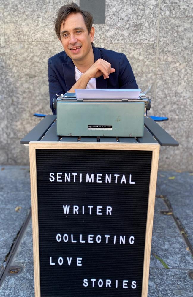 Love your style ... Trent Dalton set himself up for days on end on a Brisbane street corner with a folding table, two chairs (one for him and one for anyone who wanted to sit and share their story) and a typewriter left to him by the inspirational late mother of a dear friend. Plus a home-made sign. Picture: Fiona Franzmann