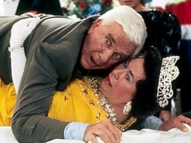 Leslie Nielsen and Jeannette Charles as the Queen in a scene from The Naked Gun: From the Files of Police Squad