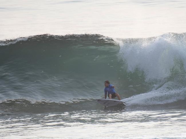 Backhand bottom turn from Archer Curtis at Sandon Point during 2020 National Rip Curl Grom Search. Please credit photo Ethan Smith/Surfing NSW