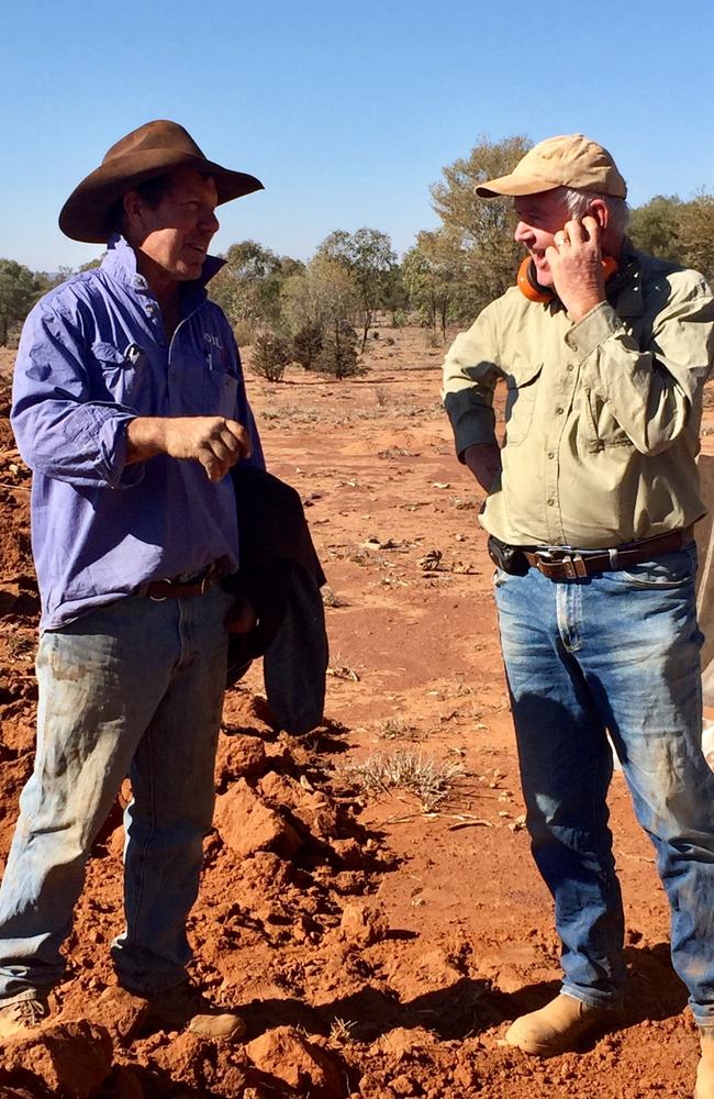 Gowan Cooke (right) has volunteered on Ben (left) and Petra Mason's Queensland farm through the Outback Links program to help them with earth improvement works.