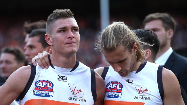 An emotional Adam Tomlinson is comforted by Nick Haynes after the grand final loss. Picture: Phil Hillyard.