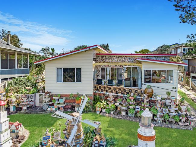 WINDMILL HOUSE: Generations of people of stopped to admire this house at 58 Shelley Beach Rd, Ballina which was decorated by former owner Peter Gutter with quirky tiled and decorated objects.