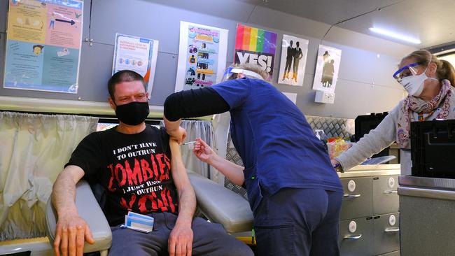 A man receives a vaccine outside the Salvation Army in Melbourne. Picture: Luis Ascui