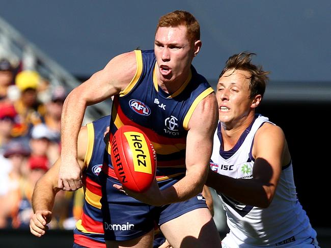 Tom Lynch gets his hand pass out. Picture Sarah Reed