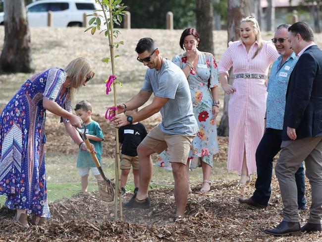 The family of Hannah Clarke plant a tree after they attend the dedication of Hannah's Place. Picture: Peter Wallis