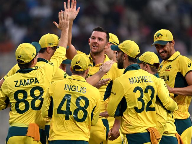 Josh Hazlewood (C) celebrates with teammates after taking the wicket of South Africa's Rassie van der Dussen during the 2023 ICC Men's Cricket World Cup one-day international (ODI) second semi-final. Picture: AFP