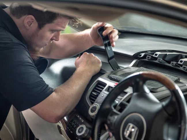 Technicians work to replace Takata airbags.