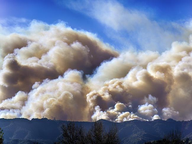 Smoke from the Palisades fire rises over a ridge as seen from the Encino section of Los Angeles. Picture: AP