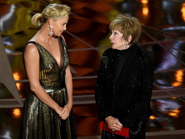 Charlize Theron and Shirley MacLaine presenting at the 89th Academy Awards.