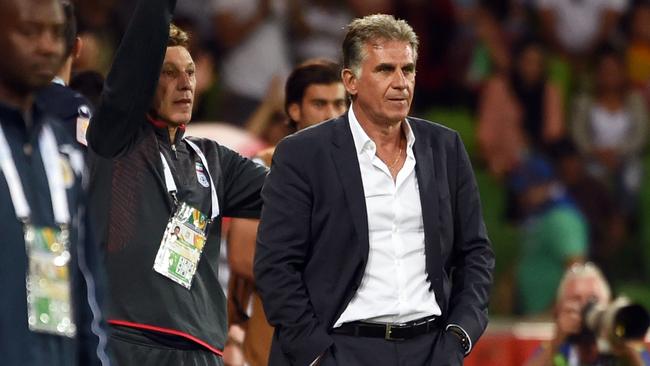 Iran's coach Carlos Quieroz (C) looks on during their football match against Bahrain at the AFC Asian Cup in Melbourne on January 11, 2015. AFP PHOTO / William WEST --IMAGE RESTRICTED TO EDITORIAL USE - STRICTLY NO COMMERCIAL USE--