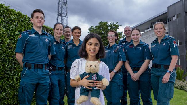 Leenah Ali, 7, is reunited with the paramedics that helped save her life. Picture: Jerad Williams