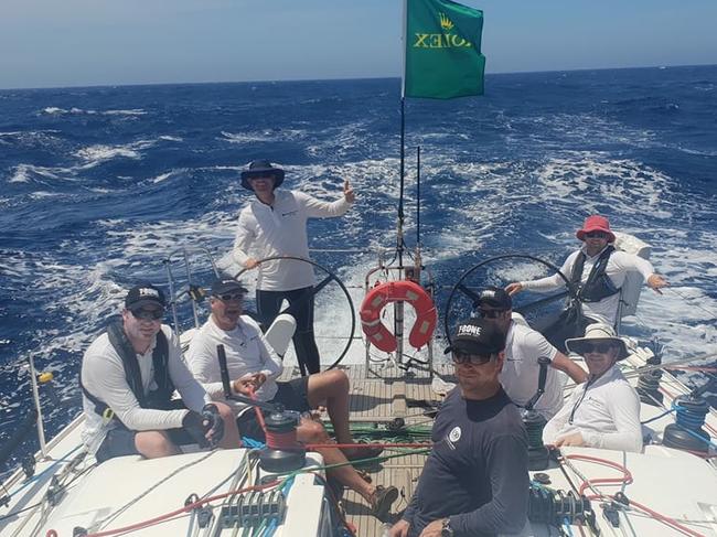 With co-skipper Rob Gourlay on the helm, the crew of Tasmanian yacht Black Sheep enjoys champagne sailing in the Sydney to Hobart. Picture: SUPPLIED