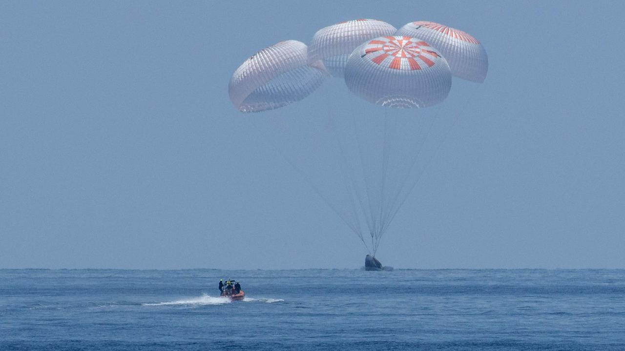 SpaceX Crew Dragon Endeavour spacecraft lands with NASA astronauts Robert Behnken and Douglas Hurley on-board in the Gulf of Mexico on August 2, 2020. They were the first astronauts to travel to and from an ISS mission on a commercial spacecraft. Picture: AFP/NASA/Bill Ingalls