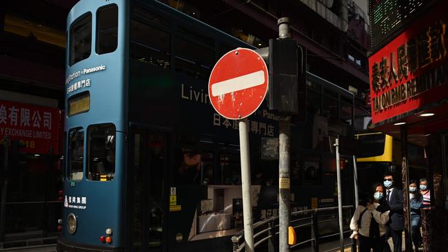 One of Hong Kong’s famous trams. New restrictions have been introduced in the city to try and dampen the spread of Omicron. (Photo by Peter PARKS / AFP)