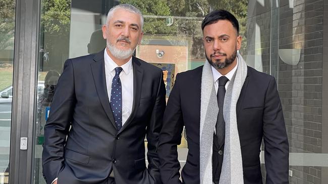 Peter Stojanovski (left) pictured with his lawyer Michael Moussa (right) has been found not guilty of filming under a schoolgirl’s skirt on a train. Picture: Ashleigh Tullis