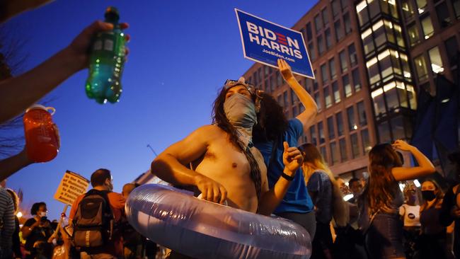 Supporters of president-elect Joe Biden celebrate on Black Lives Matter Plaza across from the White House in Washington, DC after his victory speech. Picture: AFP