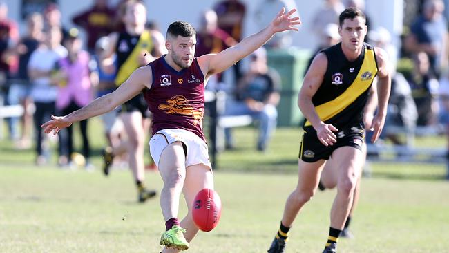 Tyler Cornish kicking a goal. Photo by Richard Gosling