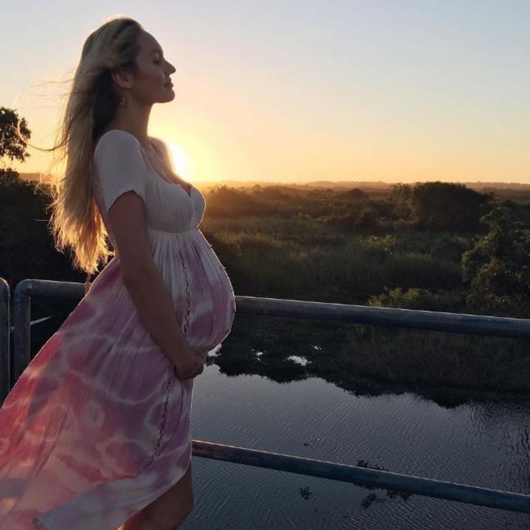 First time mum-to-be Candice Swanepoel cradles her growing baby bump. Picture: Instagram