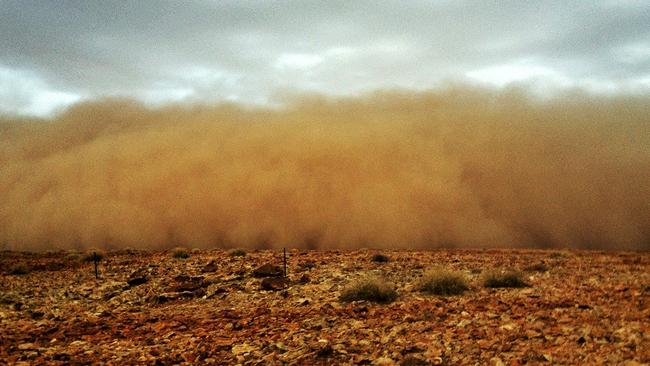 Heat is on: A dust storm near Oodnadatta taken after three successive 40C-plus days. Picture: George Norcott