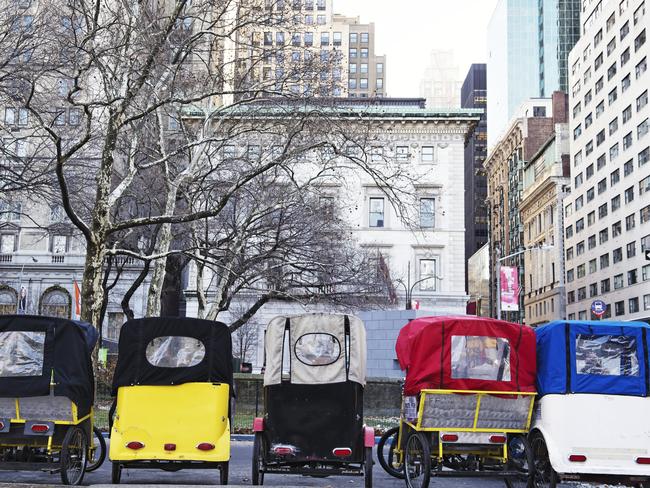 New York City, USA - December 13 , 2013: Five pedicabs parked outside Central Park in Manhattan,New York City.