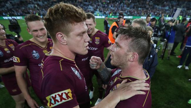 Dylan Napa and Josh McGuire as Queensland teammates. Photo: Peter Wallis