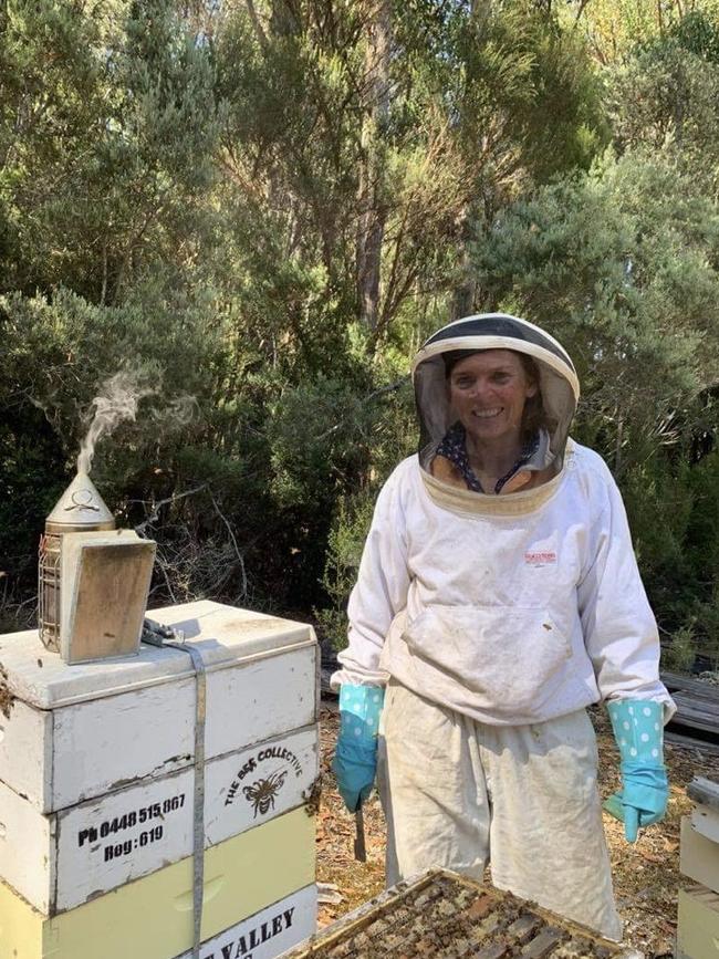 Jenni McLeod checks a hive. Picture: Supplied.