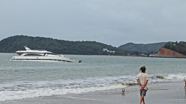 The yacht has attracted quite the crowd of onlookers since it washed up on the beach. Photos: Malcolm Wells