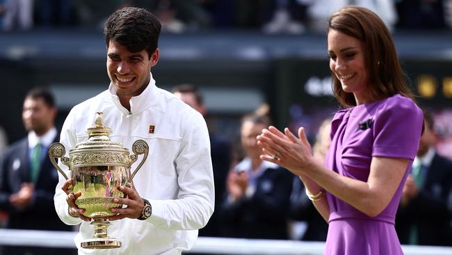 Catherine, Princess of Wales applauds Spain's Carlos Alcaraz as he receives the winner's trophy after beating Serbia's Novak Djokovic during their men's singles final tennis match at Wimbledon.