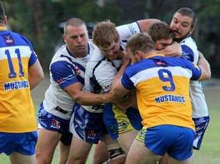 DOMINANT DEFENCE: Danny Wicks, Ben McLennan and Brett Wicks combine in the middle to drive a Murwillumbah attacker back toward his goal line. Picture: Garry Gillespie