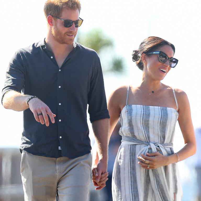 Conspiracy theorists claim Meghan – pictured with her baby bump in Australia in 2018 – was never actually pregnant. Picture: Chris Jackson/Getty Images