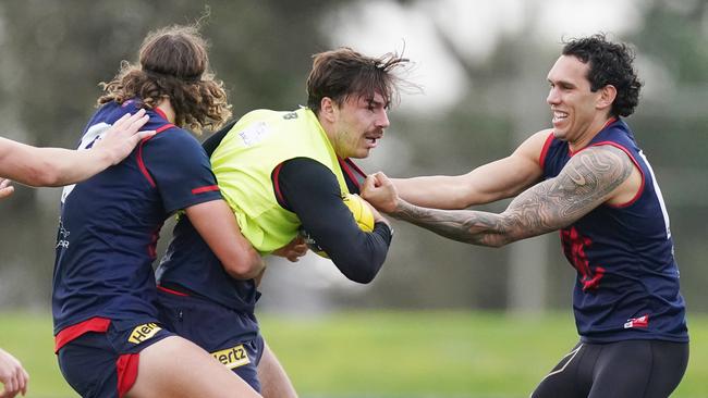 Michael Hibberd is tackled by Harley Bennell, right, at Casey Fields. Picture: Michael Dodge/AAP