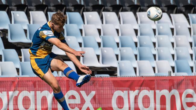 Ethan Sanders sails the ball towards the posts. Picture: Monique Harmer