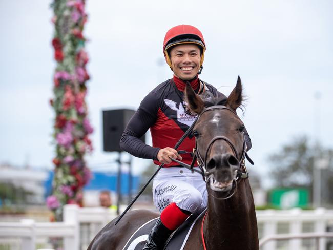 Try and wipe the smile off Allan Chau. Picture: AAP/Supplied by Michael McInally, Racing Queensland